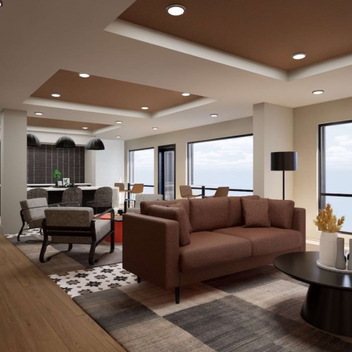 a clubroom with a couch, tables and chairs