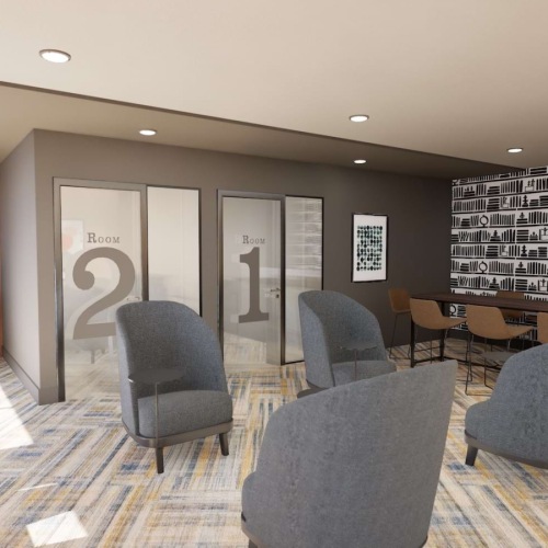 a co-working area with tables and chairs